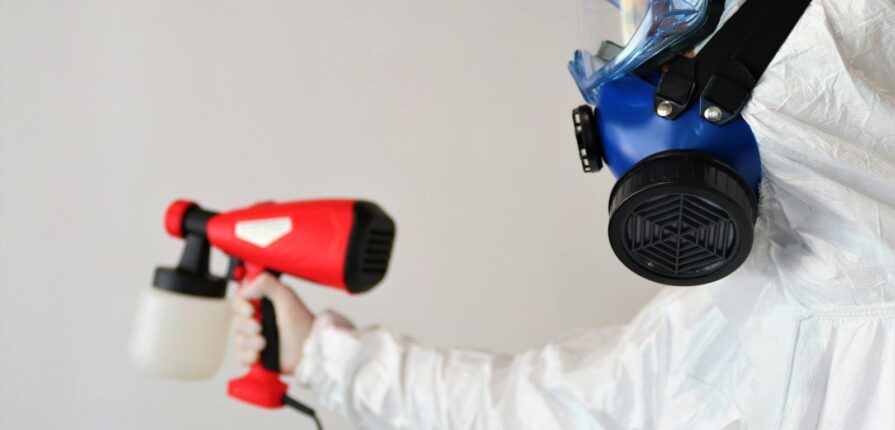 Person Disinfecting Room - Contact - Andiamo Property Restoration Inc.